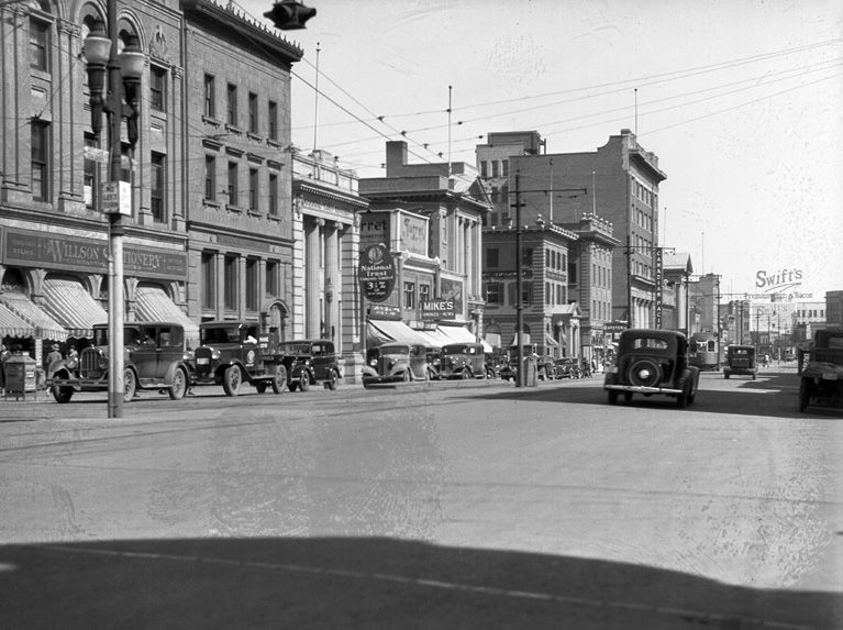 Historic view of Edmonton on 101 Street in 1930, showcasing the street's architecture and atmosphere.
