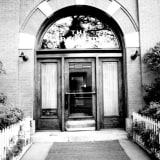 Exterior view of the entrance to Arlington Apartments.
