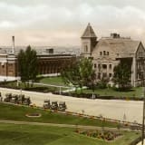 Exterior view of the Canadian National Railway Station and Queen Anne's School, circa 1930.