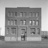 A historical photograph of the Mercer Building taken in 1930 showing its exterior.