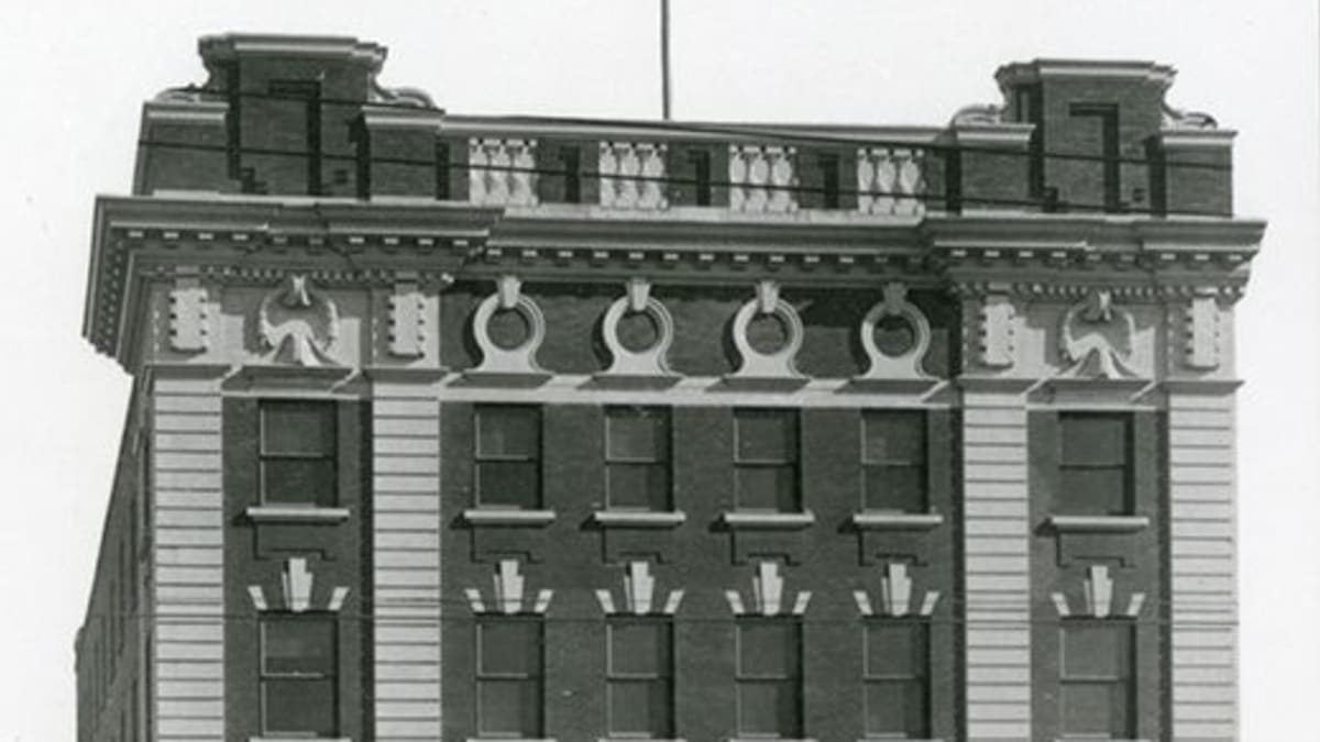 Photograph of the Moser and Ryder Block, taken in 1911, showcasing its exterior.