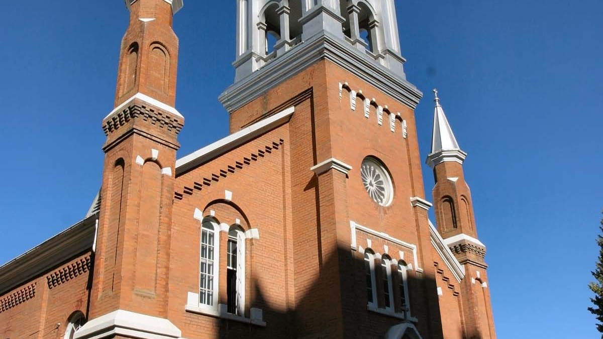 Front view of St. Joachim's Roman Catholic Church showcasing the tower in detail.
