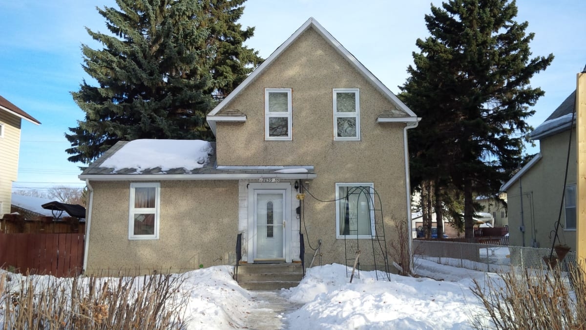 Photograph showing the Yusep & Ruptash Residences located at 12039-55 Street in the year 2013.