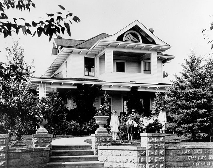 Exterior view of the Ash Residence, circa 1920, showcasing its architecture.