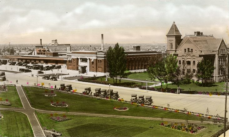 Exterior view of the Canadian National Railway Station and Queen Anne's School, circa 1930.