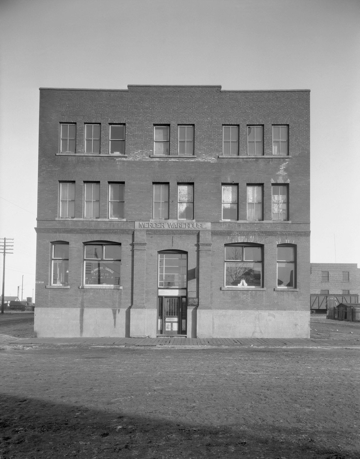 A historical photograph of the Mercer Building taken in 1930 showing its exterior.