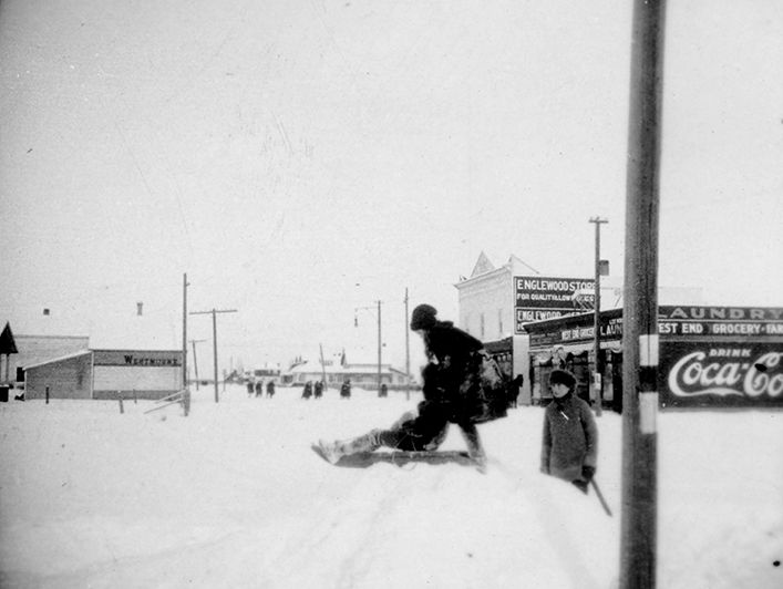 Westmount, member of Sims family outside West End Grocery.