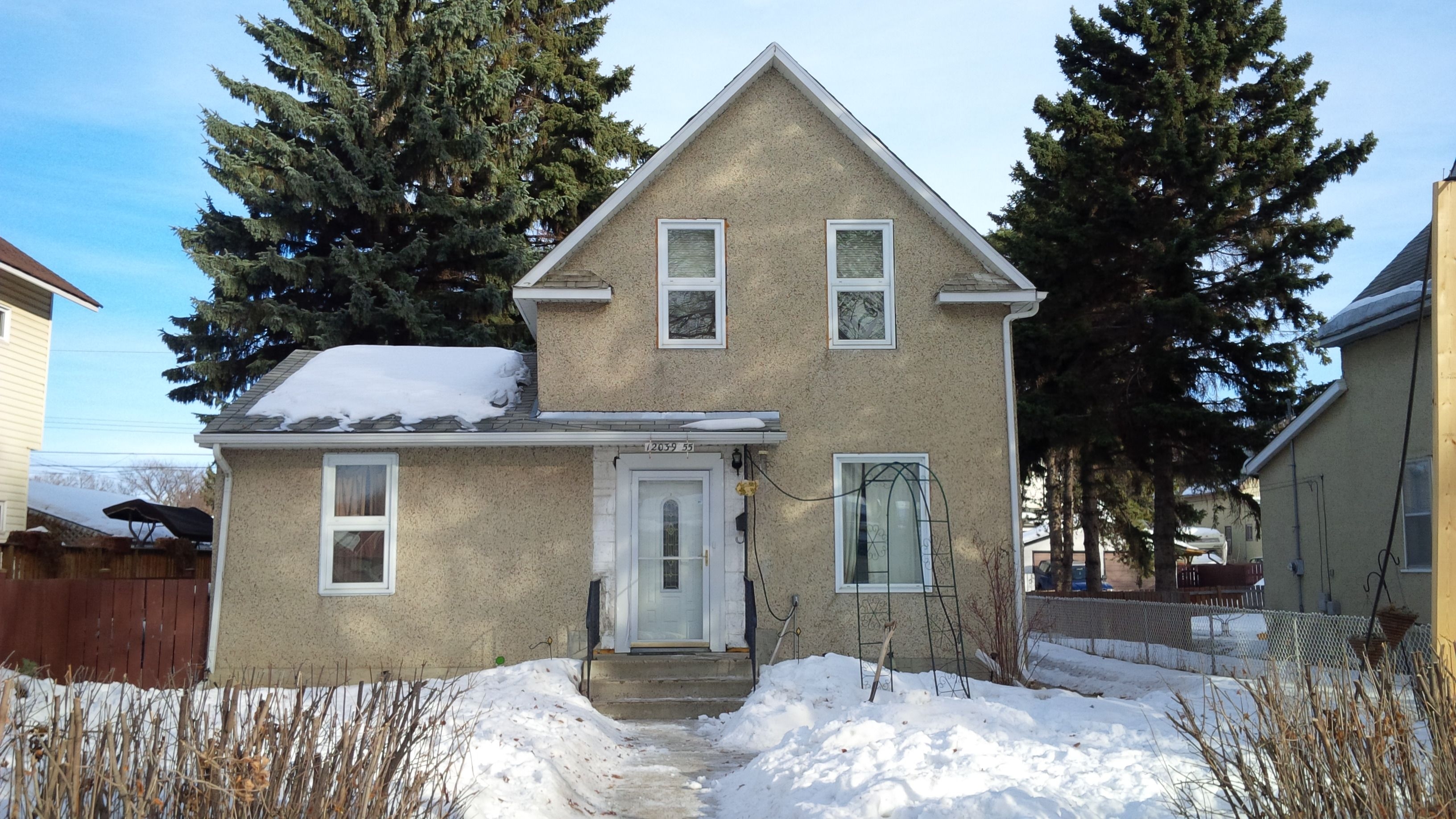 Photograph showing the Yusep & Ruptash Residences located at 12039-55 Street in the year 2013.
